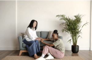 Two people engaged in a conversation, representing personalized support and mentorship for youth